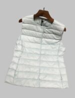 White Women's Lightweight Packable Puffer Vest - Front View, Women Sleeveless Puffer Vest, Close-Up of Premium White Duck Down Filling in Puffer Vest, Ultra-Lightweight Puffer Vest Folded Inside Travel Pouch