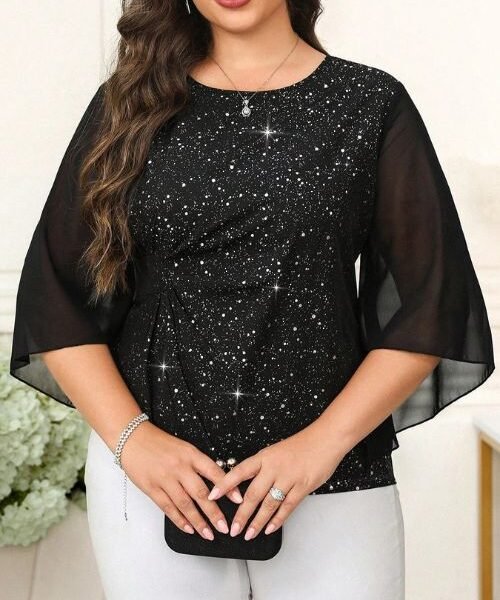 Plus size rhinestone top in black with sparkly fabric and flare sleeves, front view on model