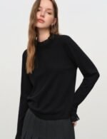 cozy knit top with ruffle neck detail