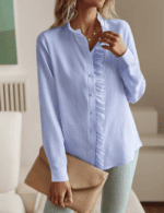 Close-up of ruched stand collar on women's single-breasted office blouse