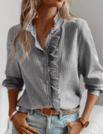Close-up of ruched stand collar on women's single-breasted office blouse